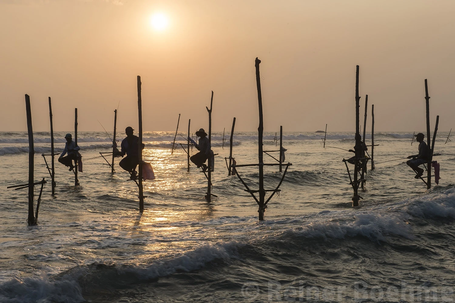 Fishermen on stilts, Sri Lanka – photo by Reiner Boehme
