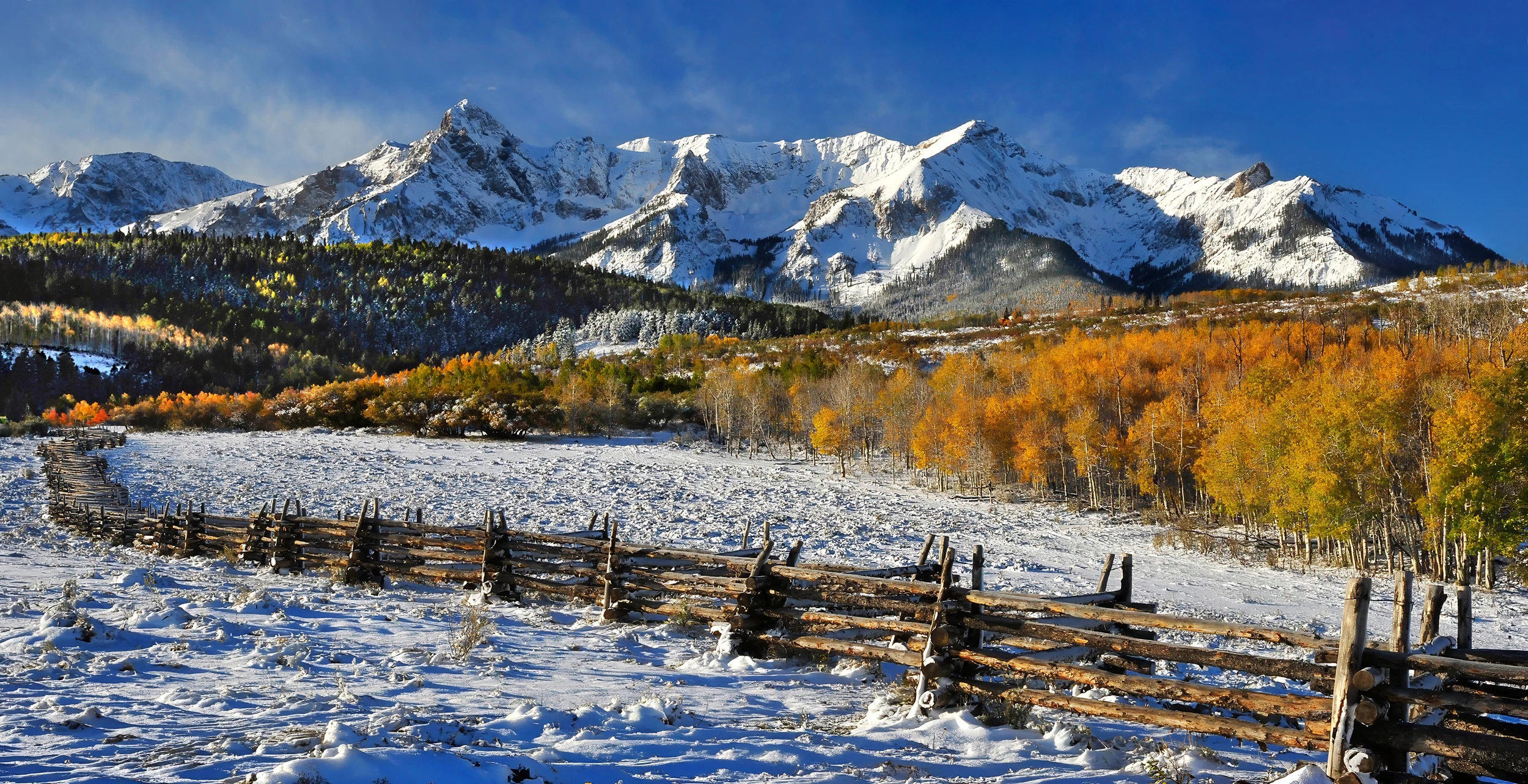 Fence with snow, Colorado – photo by Reiner Boehme